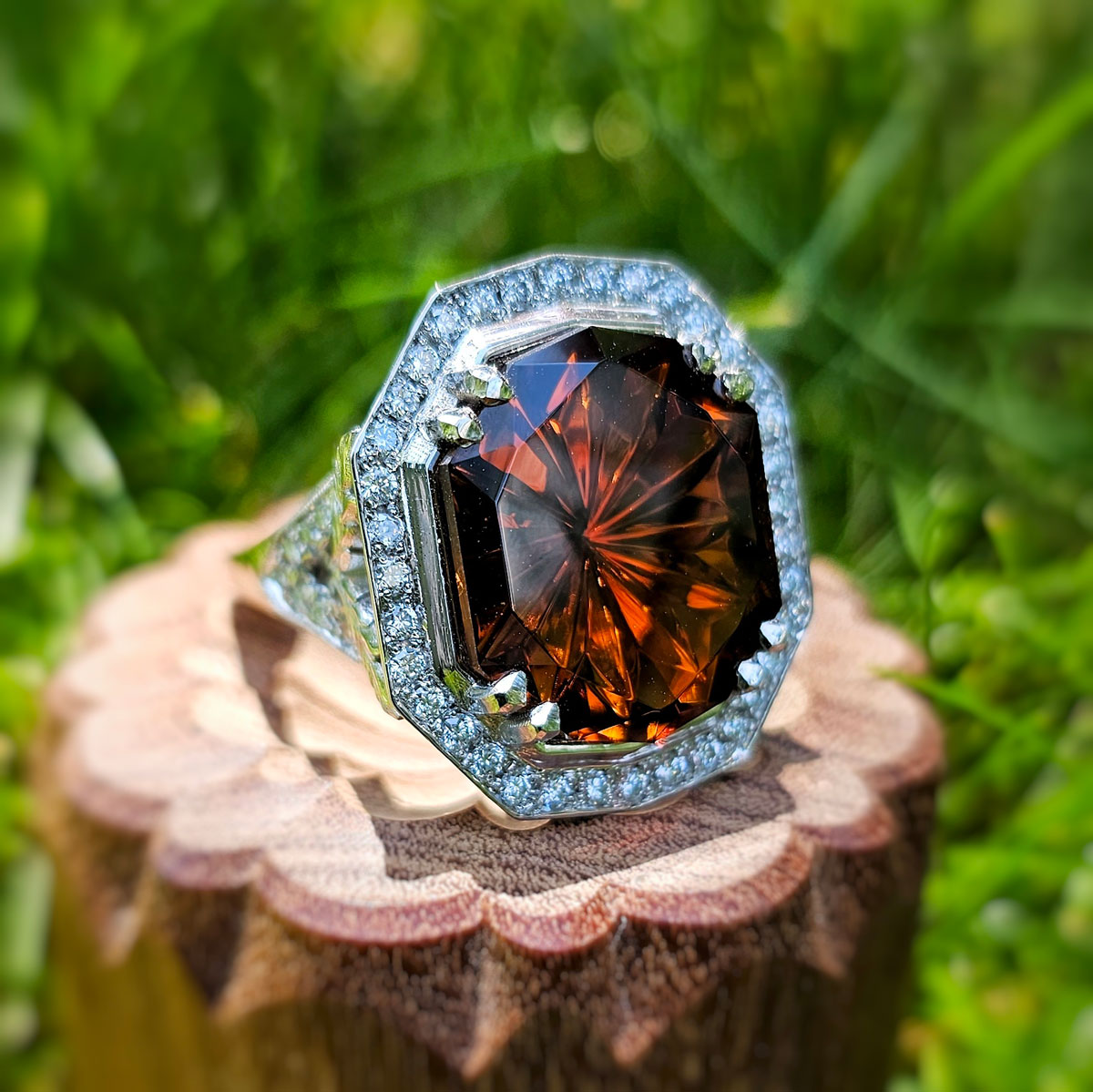 Platinum Ring with a Red Tourmaline Center and Diamond Accents